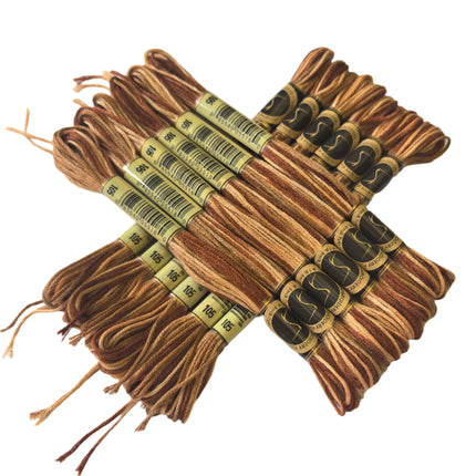 Set of brown embroidery threads with labels on a light background