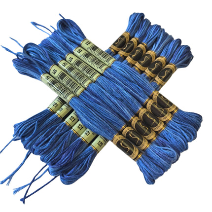 Blue embroidery floss bundles with labels on a light background