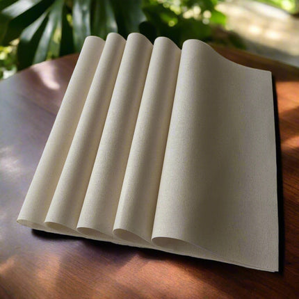 Set of beige paper sheets on a white background