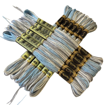 Bundles of gray shoelaces with labels on a beige background