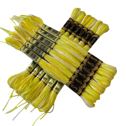 Yellow embroidery floss with labels on a light background