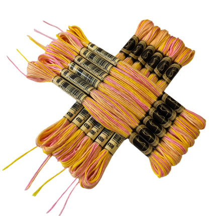 Set of pink and yellow shoelaces with labels on a light background