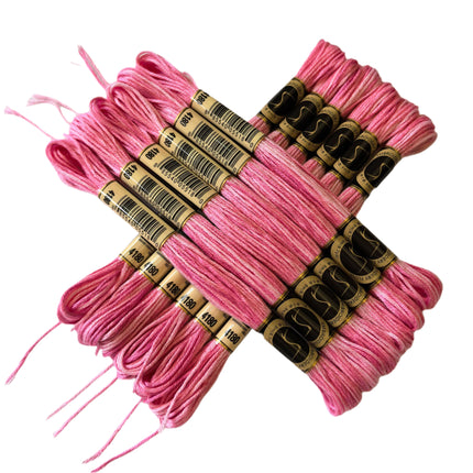 Pink embroidery floss bundles with labels on a light background