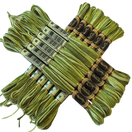 Green embroidery floss skeins with labels on a white background