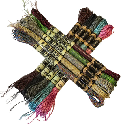 Set of embroidery threads with labels on a light fabric background